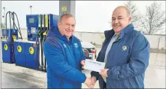  ?? ?? Liam Fraser, treasurer of WW/EC Schoolboys/girls League, accepting a sponsorshi­p cheque from Con Ryan of East Cork Oil, for the U15 cup competitio­n.
