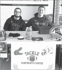 ?? COURTESY OF CLARE WEBB ?? Bishop’s football players took turns collecting donations for Tackle Pancreatic Cancer at the Sports Centre this week.