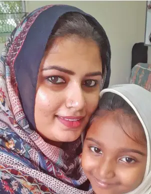  ?? ?? Aliyah Khan with her daughter at their home in Nausori Highlands, Nadi.