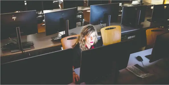  ?? EMILIO MORENATTI / THE ASSOCIATED PRESS ?? The coronaviru­s scare may force more people to work in isolation, like this teacher working in an empty classroom on Friday at the Pompeu Fabra university in Barcelona, Spain.