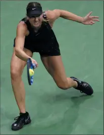  ?? AP PHOTO/ JULIO CORTEZ ?? Maria Sharapova, of Russia, returns a shot to Simona Halep, of Romania, during the first round of the U.S. Open tennis tournament, Monday in New York.