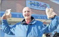  ?? SHARON MONTGOMERY-DUPE/CAPE BRETON POST ?? Cape Breton Post reporter David Jala holds up his legally purchased cannabis products at the NSLC’s Sydney River outlet on Wednesday.