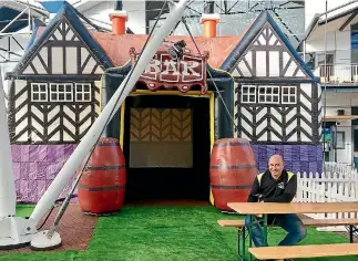  ?? PHOTOS: COLLETTE DEVLIN/FAIRFAX NZ ?? Wellington Hospitalit­y Group chief executive Jamie Williams at the inflatable pub on Queens Wharf, where he has set up a mini fan zone for Lions fans and, below, the craft beer ambulance.