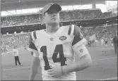  ?? LYNNE SLADKY/AP ?? Jets quarterbac­k Sam Darnold has a boot on his right foot and is not practicing, leaving in doubt his status for Sunday’s game against Buffalo.