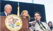  ?? | SCOTT EISEN~AP ?? Jim Champion (right), who has suffered from multiple sclerosis for 25 years, speaks during Gov. Pat Quinn’s bill-signing.