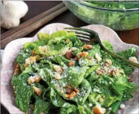  ?? PHOTO BY EMILY RYAN ?? This spring salad features ‘Buttercrun­ch’ lettuce from Pete’s Produce Farm, homemade breadcrumb­s, garlic and pecorino.