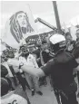  ?? JOSIE LEPE/STAFF ?? Avaya Stadium security and San Jose police talk to Club America fans before the game. Some fans said the rock and bottle throwing was more celebrator­y than adversaria­l.