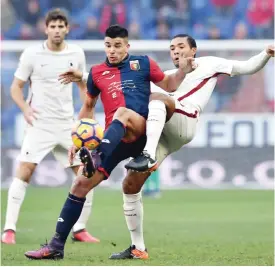  ??  ?? GENOA: Genoa’s Argentinia­n forward Giovanni Pablo Simeone, left, Roma’s Brazilian defender Juan Jesus vie for the ball during a Serie A soccer match between Genoa and Roma at Genoa’s Luigi Ferraris Stadium, Italy, yesterday. — AP