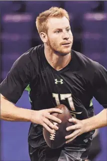  ?? L.G. Patterson Associated Press ?? CARSON WENTZ, who played at lower-level North Dakota State, has impressed NFL teams with his workouts.