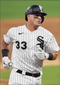  ?? Quinn Harris / TNS ?? The White Sox’s James McCann hits a solo home run in the second inning against the Cubs in September.