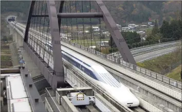  ?? Chiaki Tsukumo / Associated Press ?? Reaching 310 miles per hour takes less than a minute and a half for Japan’s maglev train, which derives its name from the way it uses an electromag­netic cushion instead of wheels for levitation and propulsion.