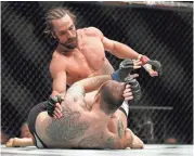  ?? USA TODAY SPORTS ?? UFC Fight Night 102 was to be a chance for Josh Samman, top, to get back on track after losing to Tamdan McCrory, bottom, and Tim Boetsch.