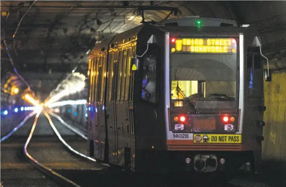  ?? Photos by Jessica Christian / The Chronicle ?? Muni trains will not run through the Twin Peaks Tunnel for two months during work to replace rails and their supporting structure inside the 100-year-old tube.