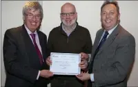  ??  ?? Peter O’Connor of Kilanerin Ballyfad Community Developmen­t Group with John Carley and Padraig O’Gorman.