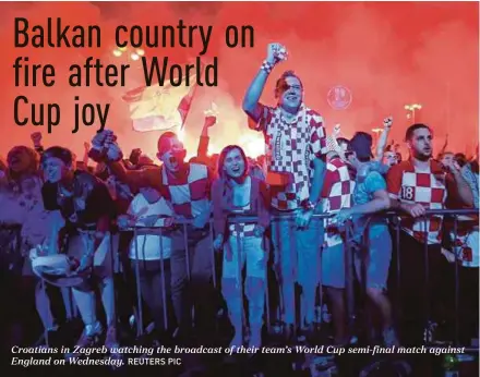  ?? REUTERS PIC ?? Croatians in Zagreb watching the broadcast of their team’s World Cup semi-final match against England on Wednesday.