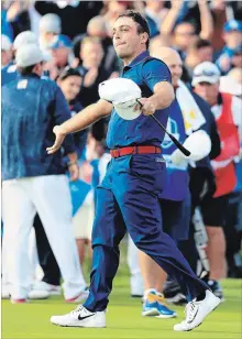  ?? ANDREW REDINGTON GETTY IMAGES ?? Team Europe’s Francesco Molinari celebrates on the 14th hole during the afternoon foursome matches of the 2018 Ryder Cup at Le Golf National on Friday. Europe leads the event 5-3.