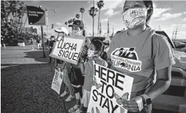  ?? SANDY HUFFAKER/GETTY-AFP ?? The Supreme Court ruled Thursday that the Deferred Action for Childhood Arrivals program will remain in place. Above, demonstrat­ors in San Diego show support for the ruling.