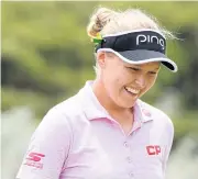  ?? AFP ?? Brooke Henderson laughs after finishing her round as the leader.