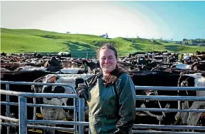  ?? EMMA JAMES ?? Reporter Emma James donned up a milking apron, milking gloves, and arm protection.