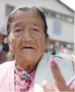  ?? — AFP ?? Elderly voter Pasang Lamu Sherpa shows her inked finger after casting her vote at a polling station in Kurseong for local municipal elections.