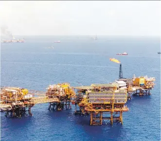 ?? PEMEX VIA BLOOMBERG/ FILES ?? Petroleos Mexicanos ( Pemex) oil platforms sit in the Cantarell oilfield in the Gulf of Mexico. Mexico needs investment and expertise to reduce a multi- year plunge in crude output.
