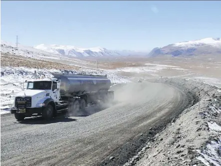  ?? VYACHESLAV OSELEDKO/AFP/GETTYIMAGE­S FILES ?? A truck moves along a road near Centerra’s Kumtor gold mine, which was the target of London-listed Chaarat’s takeover bid that Centerra had rejected in April. The Toronto-based gold company is also stuck in conflicts with Kyrgyz authoritie­s related to...