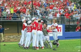  ?? CHRISTIAN ABRAHAM/HEARST CONNECTICU­T MEDIA ?? Fairfield American players celebrate their 10-0win over Maine in the New England Regional championsh­ip game on Saturday.