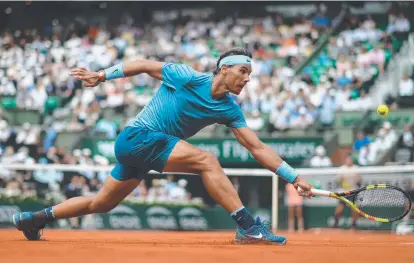  ??  ?? DOMINANT FORM: Spain's Rafael Nadal returns the ball to Germany's Maximilian Marterer during their men's match.