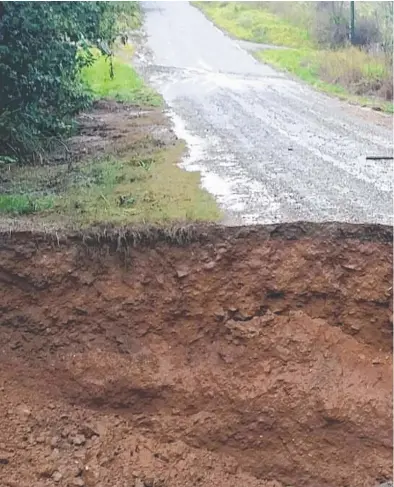  ??  ?? EPIC DAMAGE: Mareeba Shire Council assessed damage at Black Mountain Rd, Julatten, after a section of the road was washed away in heavy rains.