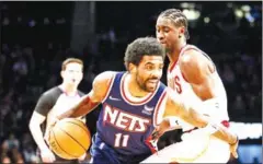  ?? AFP ?? Kyrie Irving (left) of the Brooklyn Nets dribbles as Caris LeVert of the Cleveland Cavaliers defends during the first half at Barclays Center.
