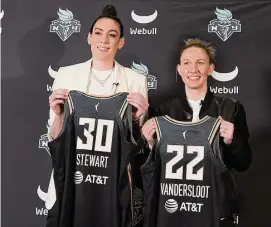  ?? Jessie Alcheh/Associated Press ?? New York Liberty forward Breanna Stewart and guard Courtney Vandersloo­t pose for a photo during a news conference on Feb. 9 in New York.