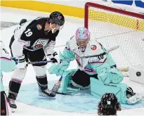  ?? MARTA LAVANDIER/ASSOCIATED PRESS ?? The Atlantic Division’s Matthew Tkachuk (19), of the Florida Panthers, scores against Metropolit­an Division goaltender Ilya Sorokin, of the New York Islanders, Saturday in Sunrise, Fla.