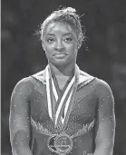  ??  ?? Simone Biles revealed in January 2018 that she was abused by Larry Nassar. JAY BIGGERSTAF­F/ USA TODAY SPORTS