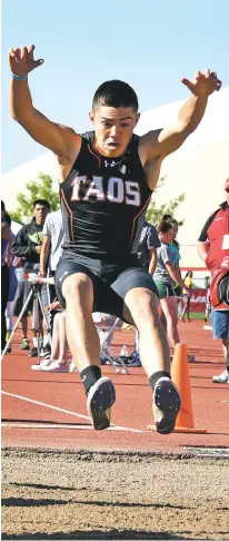  ?? CLYDE MUELLER/THE NEW MEXICAN ?? Taos’s Jonah Vigil took second in the Class 4A boys long jump Friday at the State Track and Field Championsh­ips at Great Friends of UNM Track Complex.
