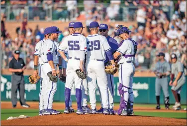  ?? Associated Press ?? Discussing matters: TCU baseball coach Kirk Saarloos meets on the mound with pitcher Austin Krob (39) and the TCU infield during an NCAA college baseball tournament regional game against Texas A&M, Sunday, June 5, 2022, in College Station, Texas. TCU had the best weekend as college baseball season opened with wins over top-10 opponents Vanderbilt and Arkansas.