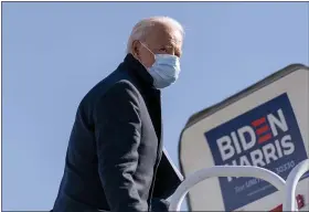  ?? ANDREW HARNIK — THE ASSOCIATED PRESS ?? Democratic presidenti­al candidate former Vice President Joe Biden boards his campaign plane in Wilmington, Del., Monday, Nov. 2, to travel to Cleveland for a rally. Biden is holding rallies in Ohio and Pennsylvan­ia.