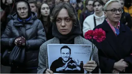  ?? ?? Protest: A woman with a portrait of Alexei Navalny outside the Russian embassy in Berlin yesterday