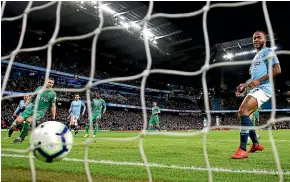  ?? GETTY IMAGES ?? Manchester City’s Raheem Sterling scores the second of his three goals in the 3-1 win over Watford yesterday.