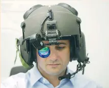  ?? (Baz Ratner/Reuters) ?? A MAN WEARS Elbit System’s advanced helmet mounted system, at the firms offices in Haifa on February 26.