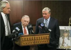  ?? MATT ROURKE — THE ASSOCIATED PRESS ?? Attorneys Thomas Kline, left, Richard Sprague and Robert Mongeluzzi take part in a news conference while standing next to a photo of train engineer Brandon Bostian in Philadelph­ia on Thursday. A Philadelph­ia judge has ordered prosecutor­s to criminally...