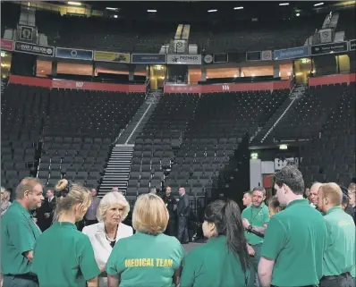  ?? PICTURES: PAUL ELLIS/PA. ?? VISIT: The Duchess of Cornwall with medical and security staff at Manchester Arena, which was bombed last month.