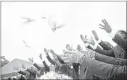  ?? ASSOCIATED PRESS ?? Pallbearer­s release doves over the casket of Ethel Lance during her burial service on Thursday in Charleston, S.C. Lance, 70, was one of the nine people killed in the shooting at Emanuel AME Church in Charleston last week.