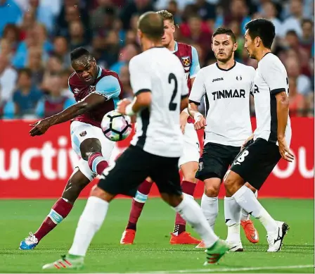  ??  ?? dream come true: West Ham’s Michail Antonio takes a shot at goal in the Europa League qualifying playoff second-leg match against Astra Giurgiu on Aug 25. — Reuters