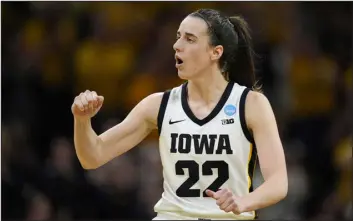  ?? CHARLIE NEIBERGALL — THE ASSOCIATED PRESS ?? Iowa guard Caitlin Clark reacts in the second half against West Virginia in a women’s NCAA Tournament game on Monday in Iowa City, Iowa.