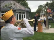  ??  ?? U.S. Navy veteran Ernest Belanger, of Wilton, plays Taps during ceremonies honoring the USS Emmons and her shipmates on Friday.