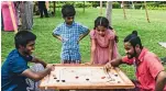  ?? Photos by Neeraj Murali ?? sri Lankan expats celebrate new Year with various activities including folk music, a game of carrom and cooking traditiona­l cuisines. —