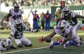  ?? SETH WENIG - THE ASSOCIATED PRESS ?? Buffalo Bills tight end Jason Croom (80) recovers a fumble by wide receiver Zay Jones , left, for a touchdown against the New York Jets during the first quarter of an NFL football game, Sunday, Nov. 11, 2018, in East Rutherford, N.J.