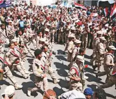  ?? Reuters ?? Pro-government troops parade to mark the 55th anniversar­y of the September 1962 revolution in the war-torn southweste­rn city of Taiz yesterday.