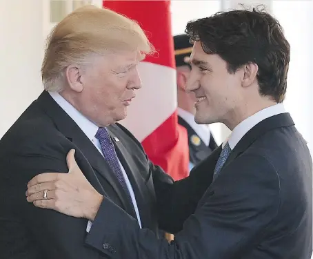  ?? MANDEL NGAN/AFP/GETTY IMAGES ?? President Donald Trump greets Prime Minister Justin Trudeau outside the West Wing of the White House on Monday.