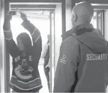 ?? VANCOUVER SUN ?? Vancouver Canucks fans will have to pass through airport-style metal detectors to enter Rogers Arena this season.